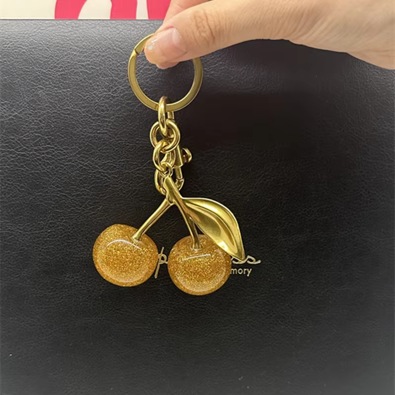 Breloques de sac pour sacs fourre-tout d'entraîneur, pendentif cerise en or scintillant, porte-clés 