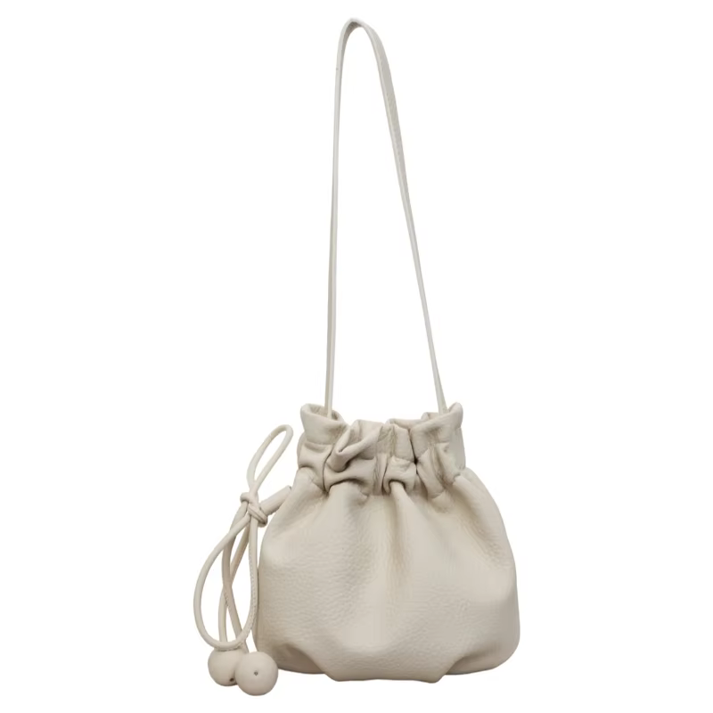 Nouveau sac seau à cordon 2026 pour femme, sac bandoulière en cuir souple avec breloque boule, mini 