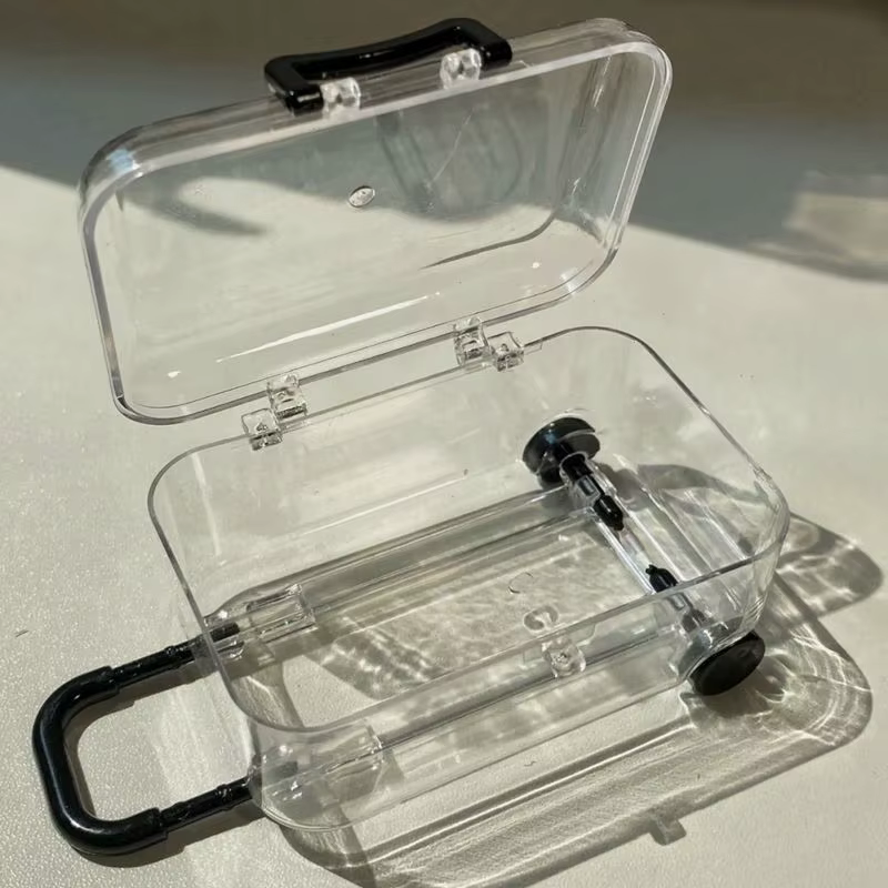 Mini valise à ornement lumineux avec roues rétractables