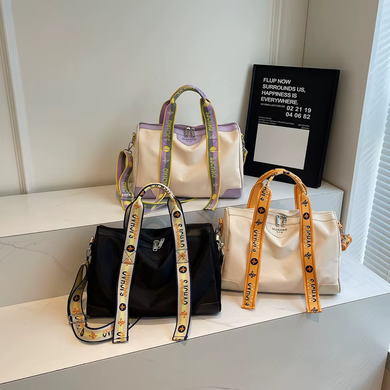 2026 plus récent sac de voyage à main polyvalent à la mode avec lettre sangle sac à bandoulière sac à bagages